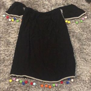 Festive black pompon dress